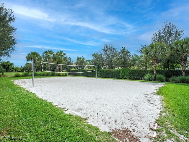 2174 Clementine St, Naples, FL 34120 - view of community with volleyball court and a lawn