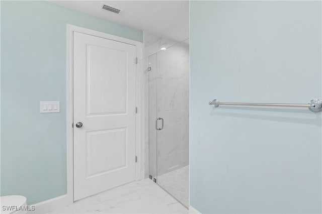 3113 68th St W, Lehigh Acres, FL 33971 - full bath with marble finish flooring, a marble finish shower, baseboards, and toilet
