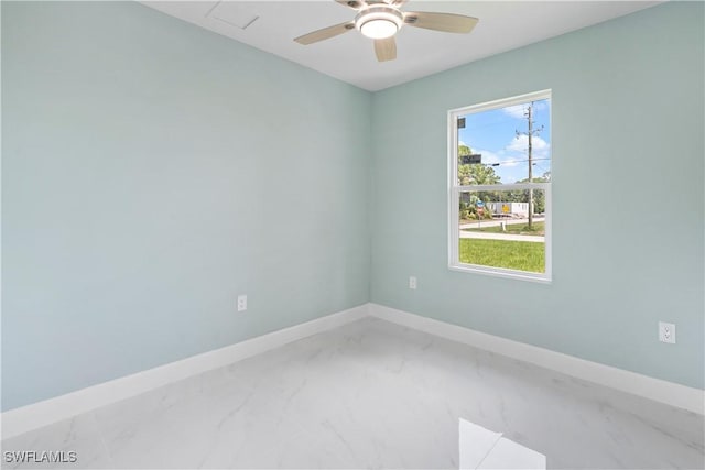 3113 68th St W, Lehigh Acres, FL 33971 - spare room with light marble finish floors, ceiling fan, and baseboards