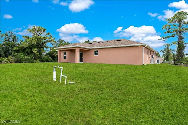 3113 68th St W, Lehigh Acres, FL 33971 - view of front facade featuring stucco siding and a front yard