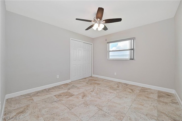 14938 Randolph Dr, Fort Myers, FL 33905 - unfurnished bedroom with a closet, baseboards, and a ceiling fan