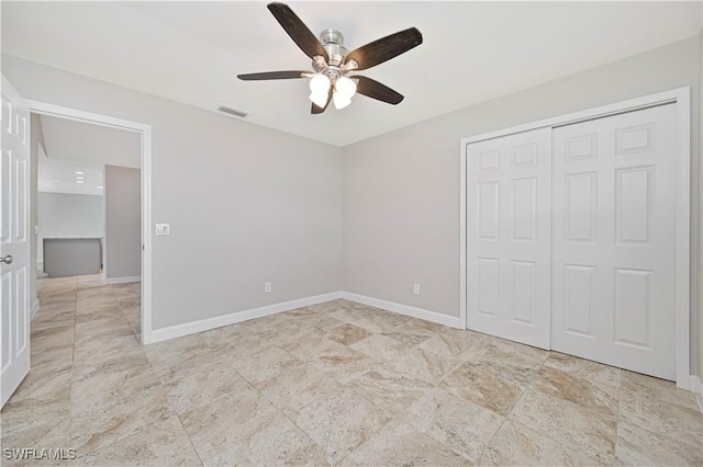 14938 Randolph Dr, Fort Myers, FL 33905 - unfurnished bedroom featuring a closet, ceiling fan, and baseboards