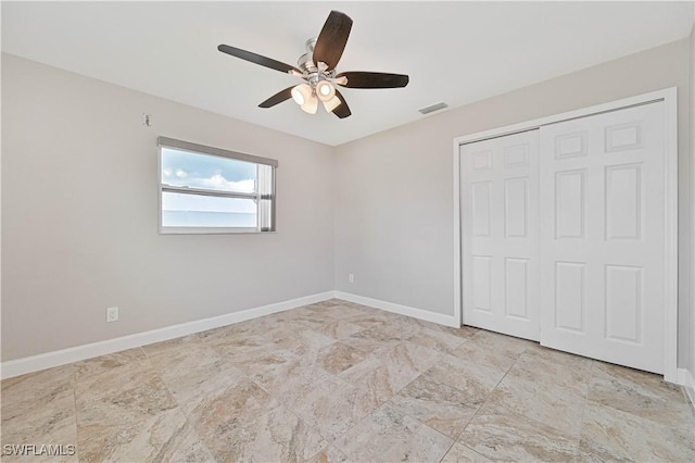 14938 Randolph Dr, Fort Myers, FL 33905 - unfurnished bedroom with a closet, baseboards, and ceiling fan