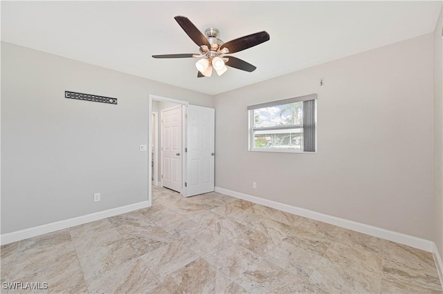 14938 Randolph Dr, Fort Myers, FL 33905 - unfurnished bedroom featuring baseboards and a ceiling fan