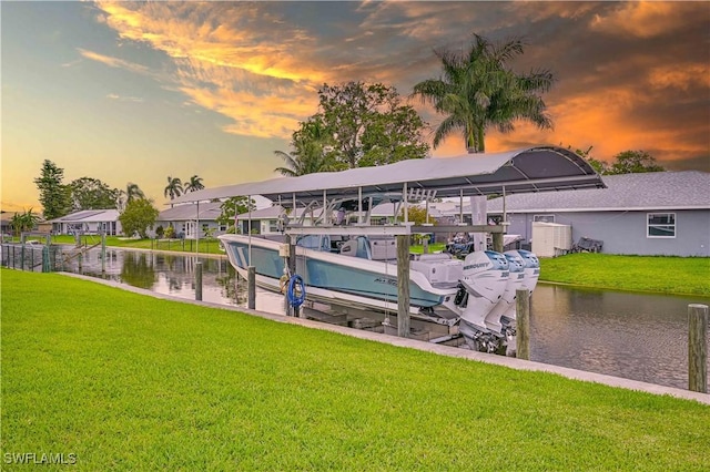 14938 Randolph Dr, Fort Myers, FL 33905 - dock area with boat lift, a water view, and a lawn