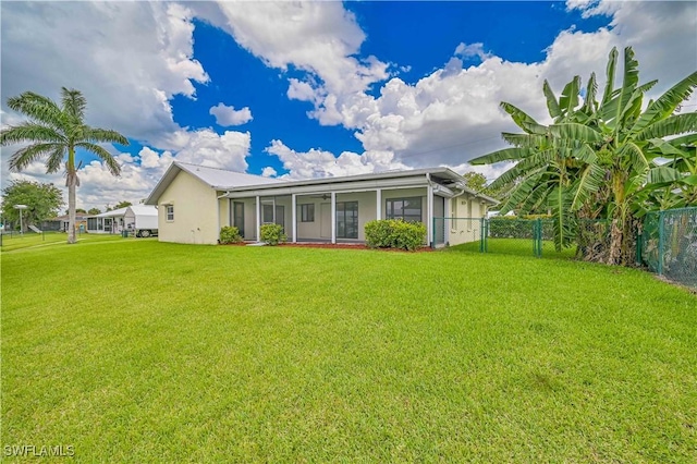 14938 Randolph Dr, Fort Myers, FL 33905 - rear view of house with a sunroom