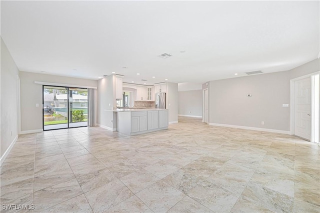 14938 Randolph Dr, Fort Myers, FL 33905 - unfurnished living room featuring baseboards