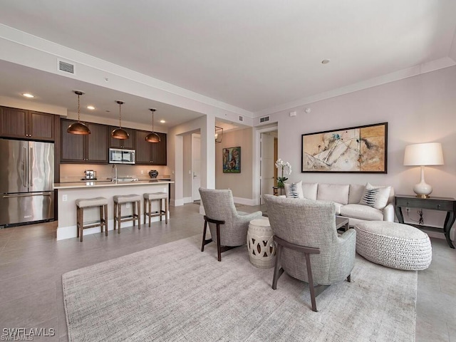 1030 3rd Ave S Unit 406, Naples, FL 34102 - living area featuring recessed lighting, ornamental molding, and baseboards