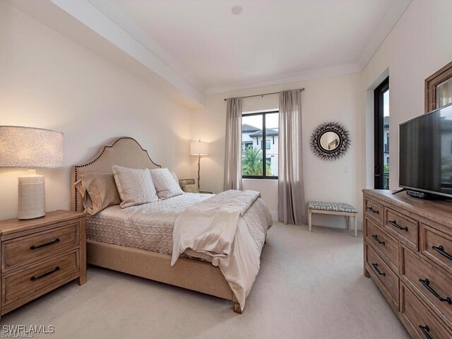 1030 3rd Ave S Unit 406, Naples, FL 34102 - bedroom featuring light carpet and ornamental molding