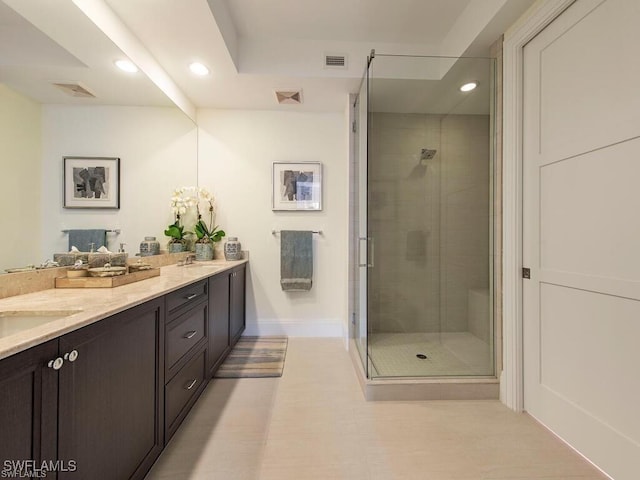 1030 3rd Ave S Unit 406, Naples, FL 34102 - bathroom with double vanity, recessed lighting, a stall shower, and baseboards