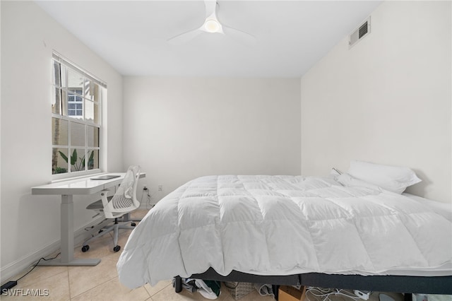 1630 Tarpon Bay Dr S Unit 102, Naples, FL 34119 - tiled bedroom featuring a ceiling fan, baseboards, and an office area