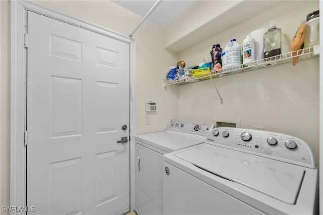 1630 Tarpon Bay Dr S Unit 102, Naples, FL 34119 - laundry room featuring independent washer and dryer
