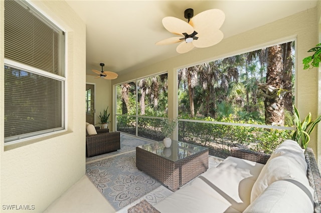 1630 Tarpon Bay Dr S Unit 102, Naples, FL 34119 - sunroom featuring a ceiling fan and an outdoor hangout area