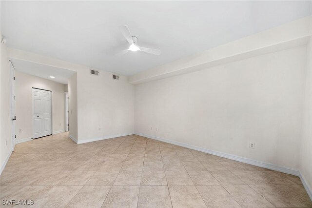 1630 Tarpon Bay Dr S Unit 102, Naples, FL 34119 - unfurnished room featuring a ceiling fan, baseboards, and light tile patterned floors