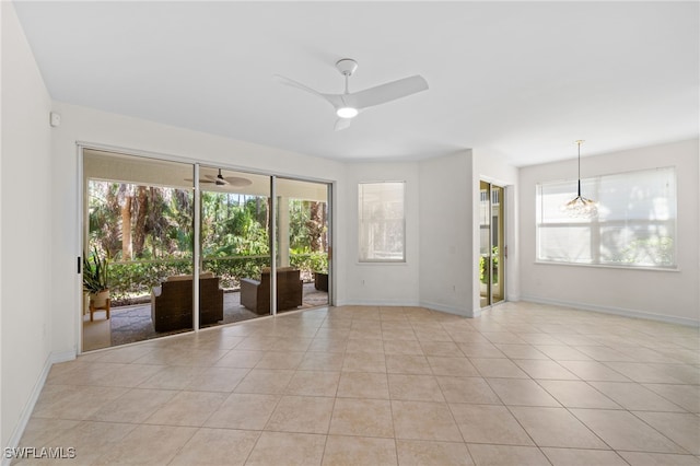 1630 Tarpon Bay Dr S Unit 102, Naples, FL 34119 - unfurnished room with a ceiling fan, baseboards, and light tile patterned flooring