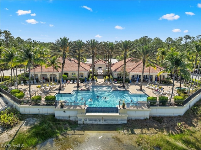 1630 Tarpon Bay Dr S Unit 102, Naples, FL 34119 - community pool featuring a patio