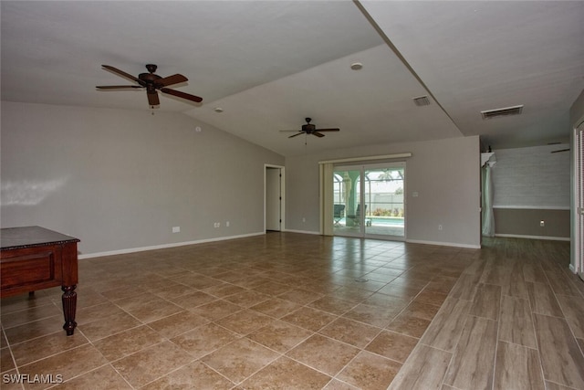1918 NE 3rd St, Cape Coral, FL 33909 - tiled spare room with a ceiling fan, baseboards, and vaulted ceiling