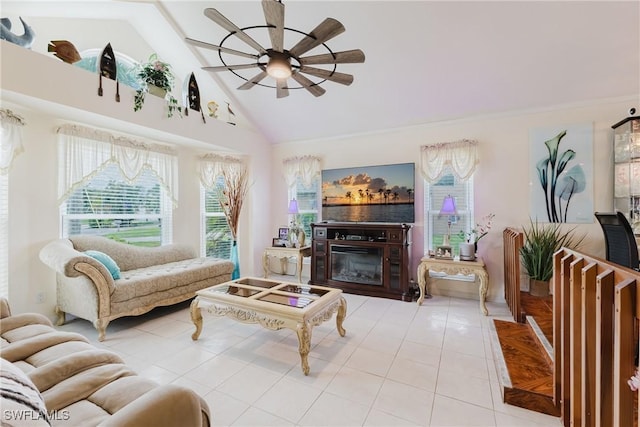 1234 SE 13th Ave, Cape Coral, FL 33990 - living room with a ceiling fan, tile patterned flooring, a glass covered fireplace, and high vaulted ceiling