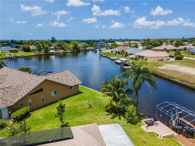 1234 SE 13th Ave, Cape Coral, FL 33990 - aerial perspective of suburban area with a large body of water