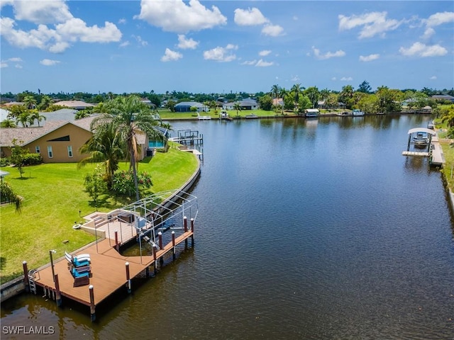 1234 SE 13th Ave, Cape Coral, FL 33990 - dock area with boat lift, a water view, and a lawn