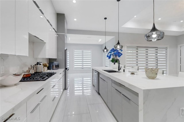 2909 2nd Ave NE, Naples, FL 34120 - kitchen with a sink, modern cabinets, white cabinetry, light tile patterned flooring, and recessed lighting