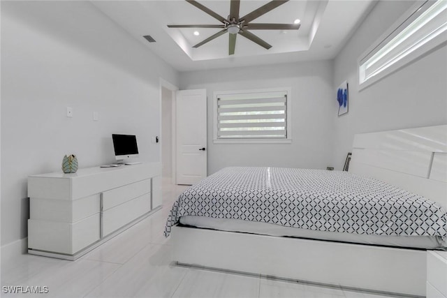 2909 2nd Ave NE, Naples, FL 34120 - bedroom featuring a tray ceiling, recessed lighting, light tile patterned floors, and ceiling fan
