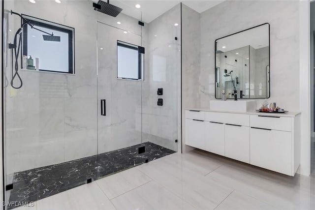 2909 2nd Ave NE, Naples, FL 34120 - bathroom featuring a marble finish shower and vanity