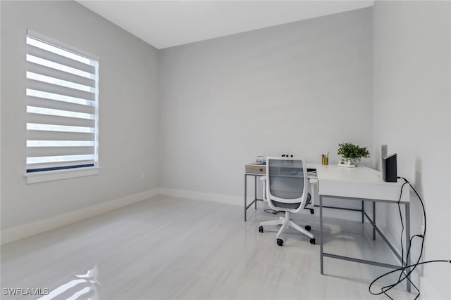 2909 2nd Ave NE, Naples, FL 34120 - home office with healthy amount of natural light and baseboards