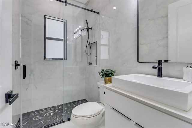 2909 2nd Ave NE, Naples, FL 34120 - full bath with a shower stall, toilet, vanity, and tile walls