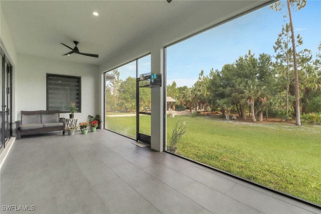 2909 2nd Ave NE, Naples, FL 34120 - unfurnished sunroom featuring ceiling fan
