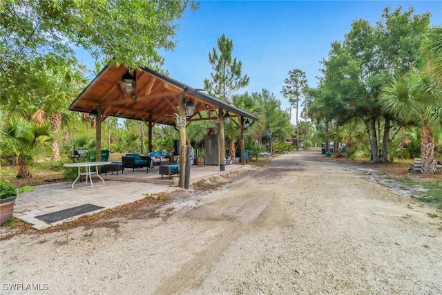 2909 2nd Ave NE, Naples, FL 34120 - view of home's community featuring a gazebo and a patio