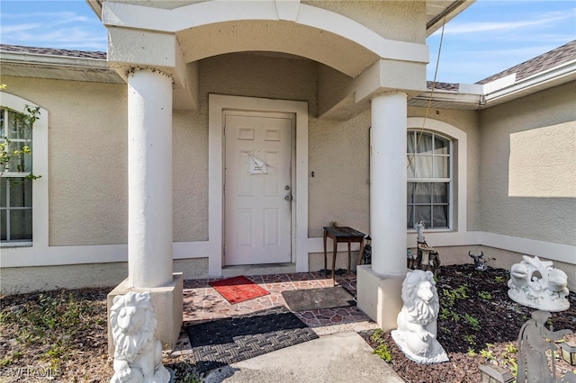 3309 19th St W, Lehigh Acres, FL 33971 - view of exterior entry with stucco siding
