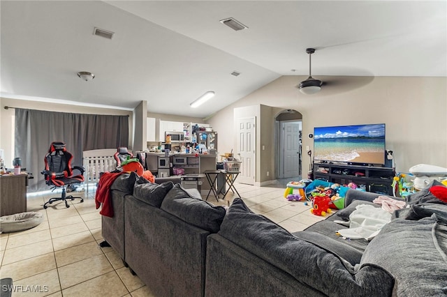 3309 19th St W, Lehigh Acres, FL 33971 - living room featuring light tile patterned flooring and vaulted ceiling