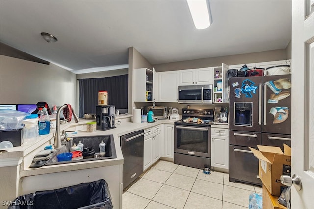 3309 19th St W, Lehigh Acres, FL 33971 - kitchen with stainless steel appliances, light tile patterned floors, open shelves, and a sink