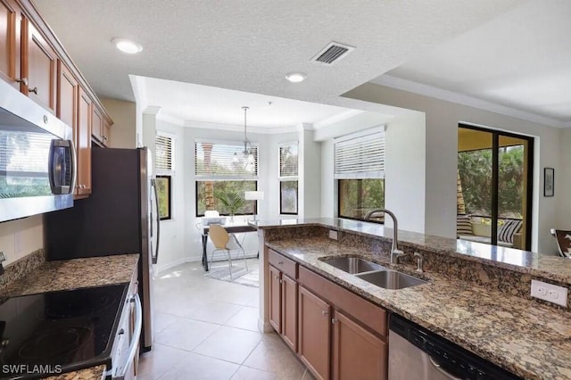 9834 Giaveno Cir Unit 1716, Naples, FL 34113 - kitchen with a sink, stainless steel appliances, plenty of natural light, ornamental molding, and recessed lighting