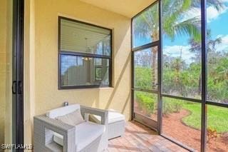 9834 Giaveno Cir Unit 1716, Naples, FL 34113 - sunroom / solarium with plenty of natural light
