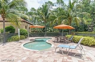 9834 Giaveno Cir Unit 1716, Naples, FL 34113 - view of pool featuring a patio area