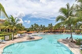 9834 Giaveno Cir Unit 1716, Naples, FL 34113 - community pool with a patio