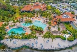 9834 Giaveno Cir Unit 1716, Naples, FL 34113 - aerial overview of property's location with a pool