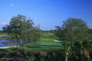9834 Giaveno Cir Unit 1716, Naples, FL 34113 - surrounding community with golf course view and a water view