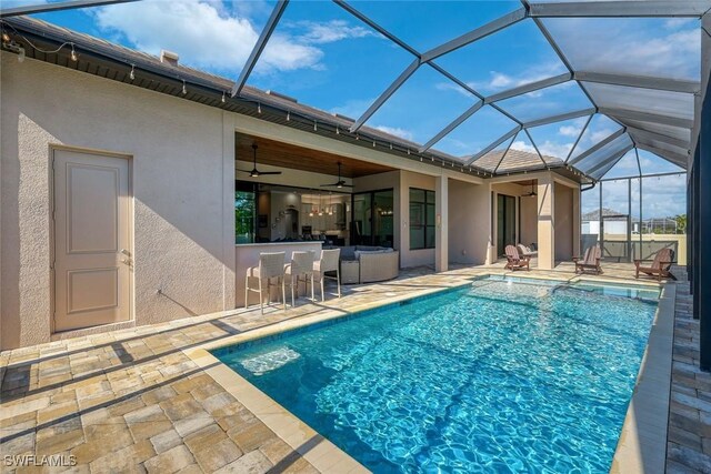 605 SW 39th Ave, Cape Coral, FL 33991 - outdoor pool with a patio, a ceiling fan, and glass enclosure