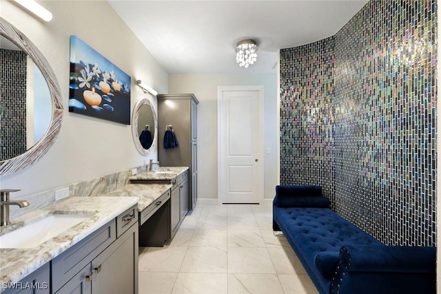 605 SW 39th Ave, Cape Coral, FL 33991 - bathroom featuring marble finish floors, two vanities, and tiled shower