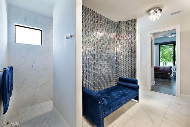 605 SW 39th Ave, Cape Coral, FL 33991 - bathroom with a walk in shower, baseboards, and marble look tiles