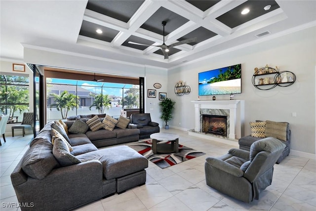 605 SW 39th Ave, Cape Coral, FL 33991 - living area featuring ceiling fan, a premium fireplace, crown molding, a towering ceiling, and baseboards