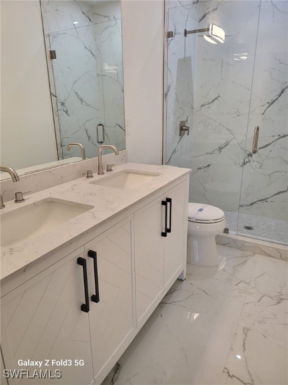 521 Frank Jewett Ave S, Lehigh Acres, FL 33974 - full bath with marble finish flooring, toilet, a marble finish shower, and double vanity