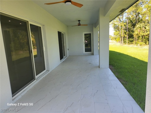 521 Frank Jewett Ave S, Lehigh Acres, FL 33974 - view of patio / terrace with a ceiling fan