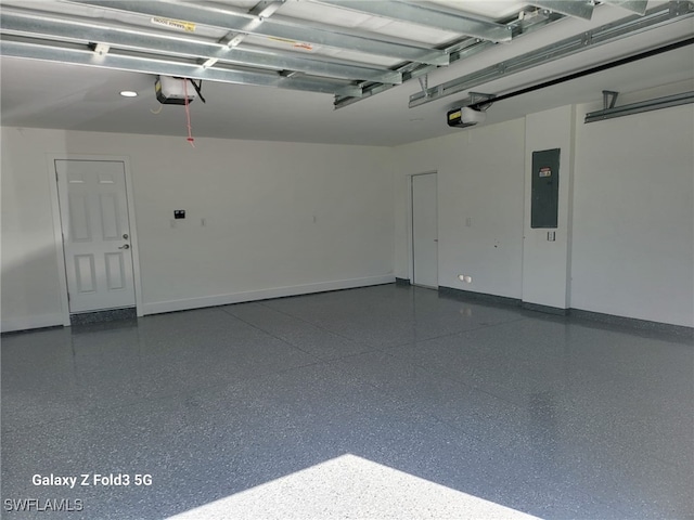 521 Frank Jewett Ave S, Lehigh Acres, FL 33974 - garage with a garage door opener, electric panel, and baseboards