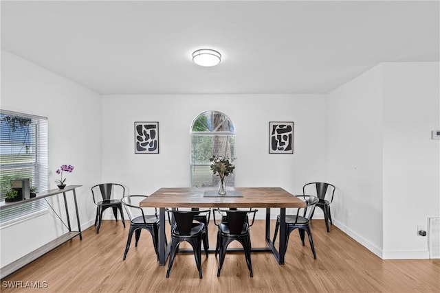 3303 6th St SW, Lehigh Acres, FL 33976 - dining space with light wood-type flooring and baseboards