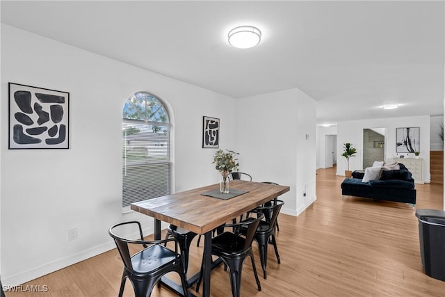3303 6th St SW, Lehigh Acres, FL 33976 - dining room with light wood finished floors and baseboards