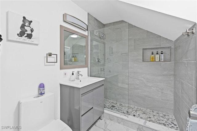 3303 6th St SW, Lehigh Acres, FL 33976 - full bath featuring a tile shower, vanity, marble look tile flooring, vaulted ceiling, and toilet